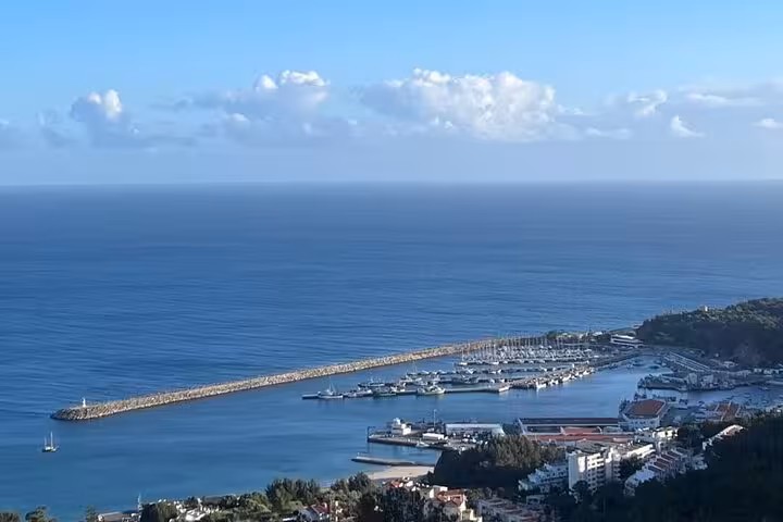 Coastal marina viewpoint near Lisbon, scenic drive stop on premium all-inclusive wine and food tour