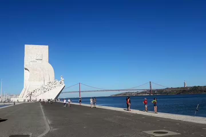 Discover Lisbon's iconic waterfront with the Monument to the Discoveries and 25 de Abril Bridge on the World Heritage Deluxe Tour.