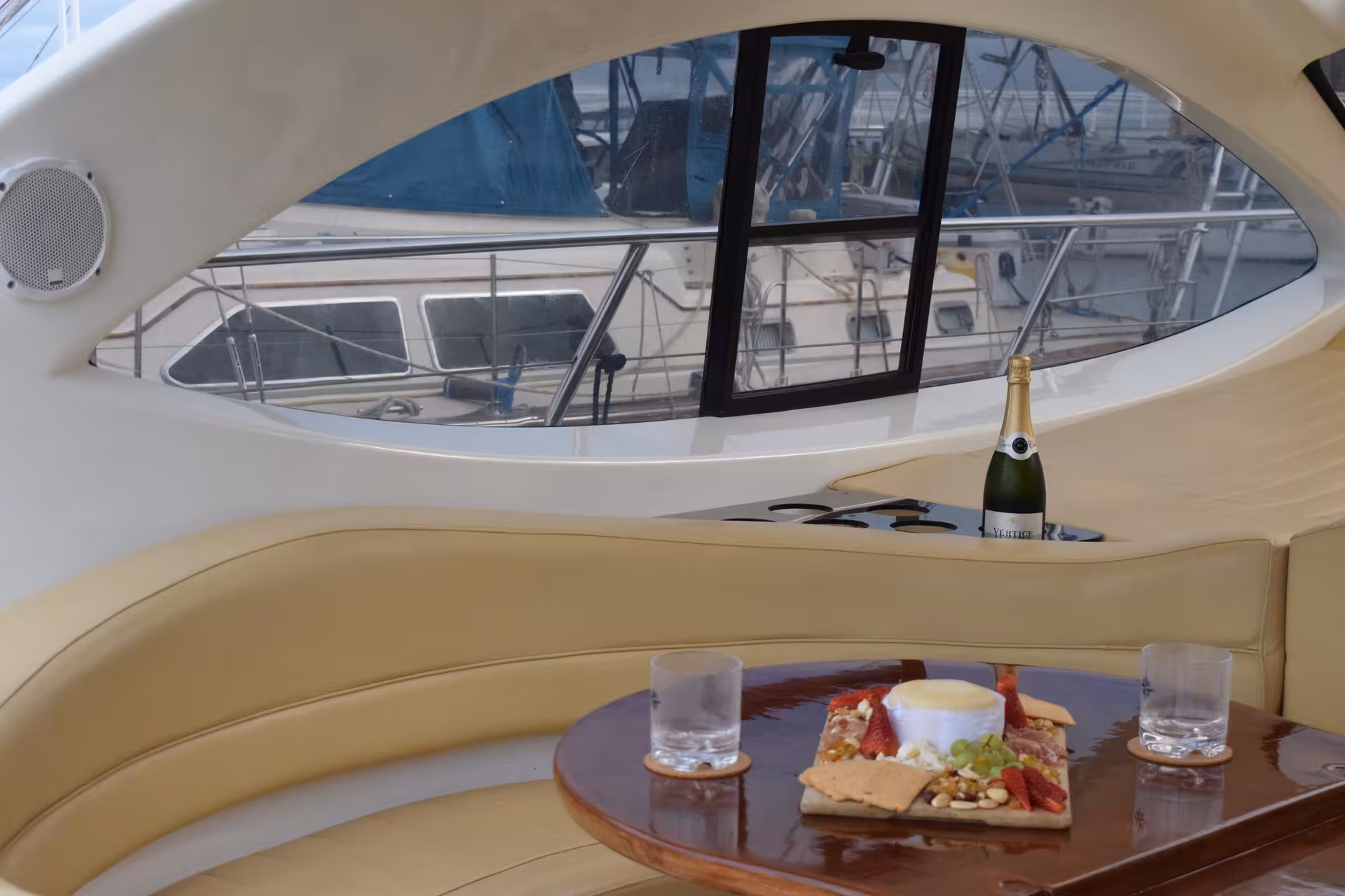 Yacht lounge with Lisbon marina views, champagne and tapas, A Lisbon Tale by On Tales private cruise