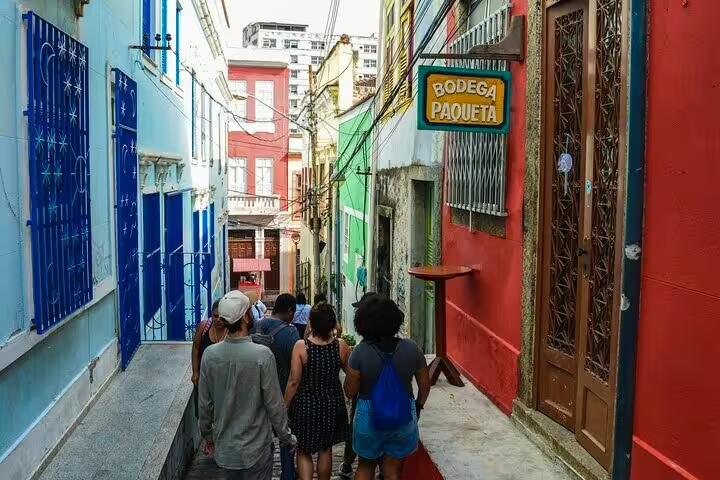 Visitors explore colorful streets of Little Africa in Rio, showcasing vibrant Afro-Brazilian culture and heritage.