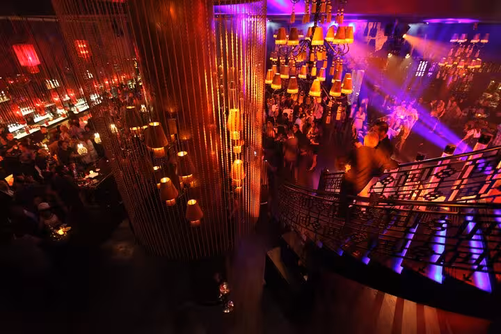 Little Buddha Hurghada nightclub crowd and staircase, vibrant lights on a night out tour with transport