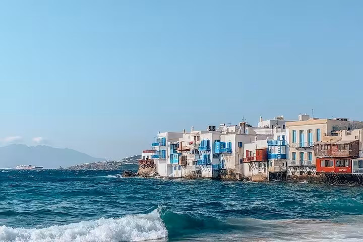 Little Venice waterfront houses in Mykonos Chora, scenic stop on cruise traveler walking tour in Greece