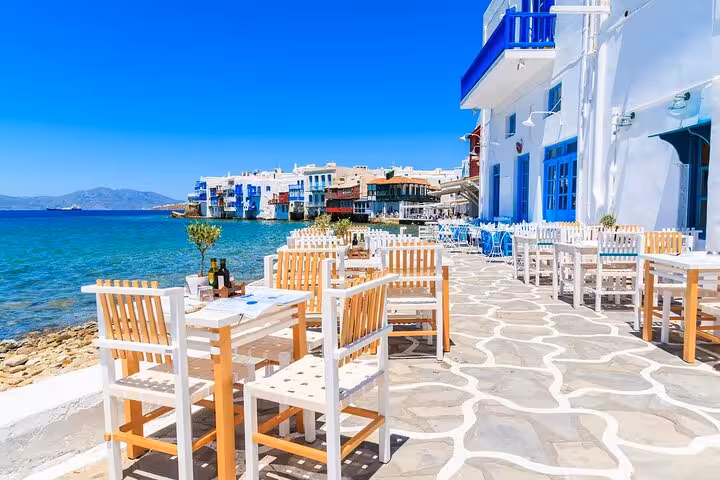 Seafront cafe terrace in Little Venice Mykonos, part of a 5-day private tour from Athens to Mykonos and Santorini