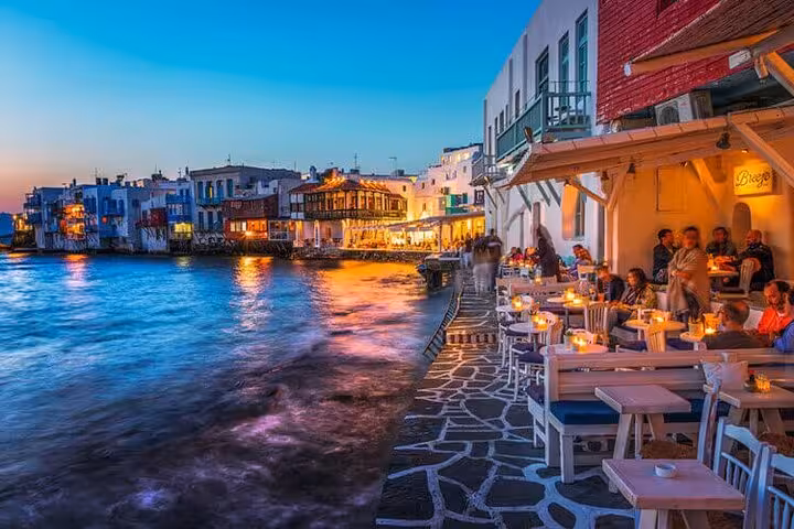 Little Venice Mykonos at sunset with waterfront dining, featured on a 5-day private Athens to Mykonos and Santorini tour