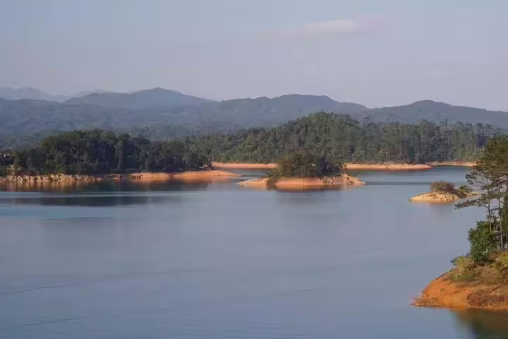 Scenic view of tranquil lake and islands at Liuxihe National Forest Park, ideal for nature lovers visiting from Guangzhou.