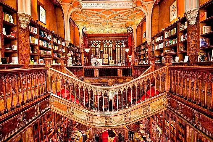 Lavish interior of Livraria Lello, a historic bookstore in Porto, famous for its ornate design, visited on a Lisbon day trip.