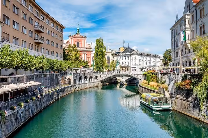 Ljubljana city center on the Ljubljanica River, scenic stop on a private day tour from Vienna