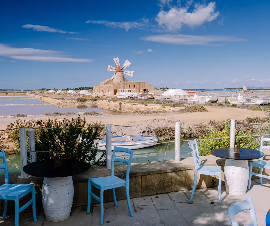 Waterfront café overlooking Lo Stagnone saltpans and historic windmill near Mothia Island on private tour from Palermo