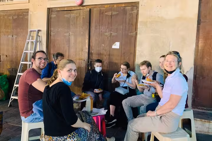 Group tasting local Emirati street food in Al Fahidi Old Dubai on the 6 tastings walking tour