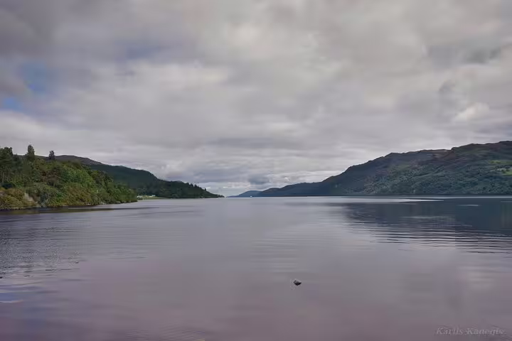 Calm waters of Loch Ness framed by Highland hills, iconic viewpoint on Loch Ness Legends private scenic tour