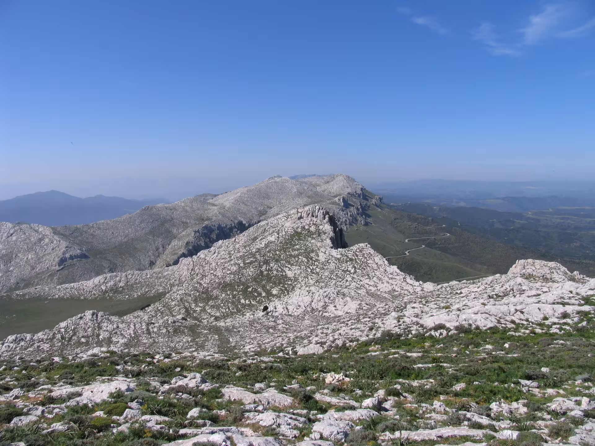 Breathtaking panorama of Montalbo's rugged landscape with winding trails, ideal for hiking in Lodè.