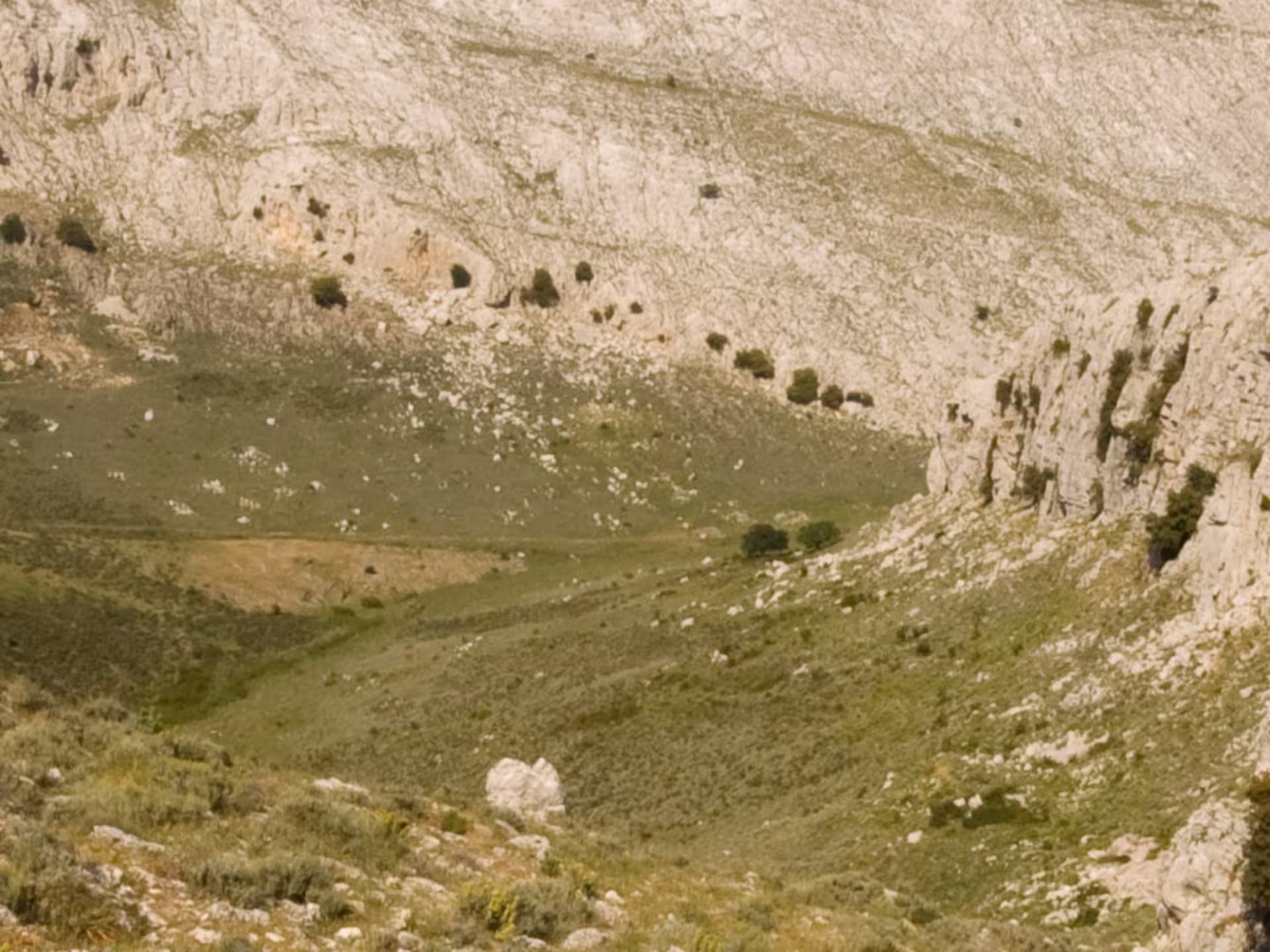 Scenic view of rocky terrain and lush greenery on the Punta Cupeti trekking route, Montalbo, Sardinia.
