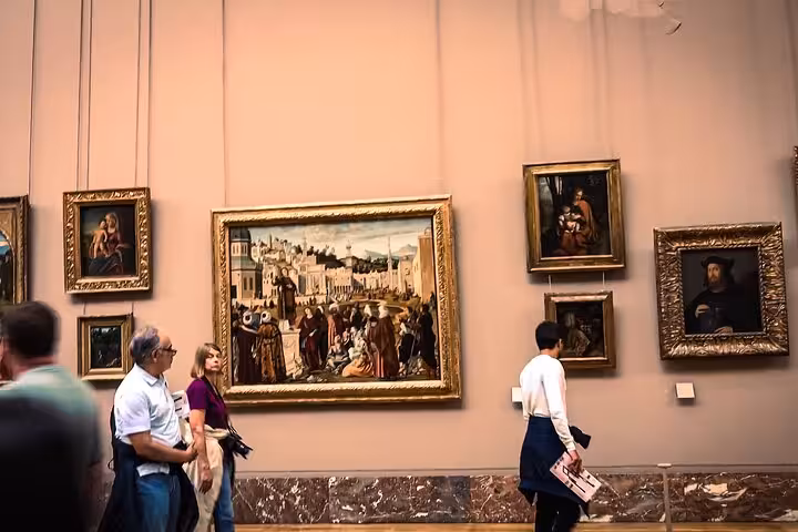 Louvre Museum gallery tour in Paris with classic paintings, part of private luxury Eiffel Tower lunch package