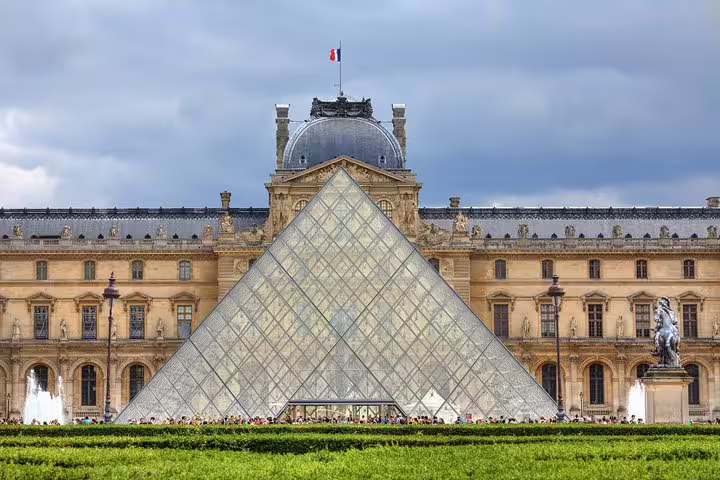 Louvre Museum with iconic glass pyramid in Paris, ideal for family-friendly private tour exploring city highlights and kid-friendly exhibits.