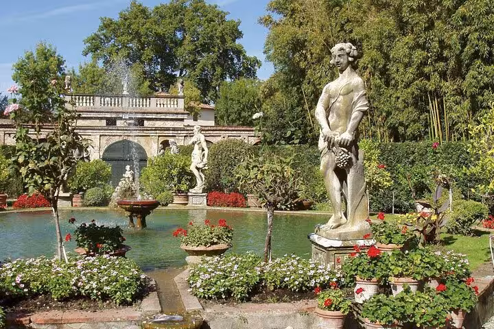 Beautiful garden with classical statues and fountains in Lucca, ideal spot on Discover Lucca and Pisa tour.