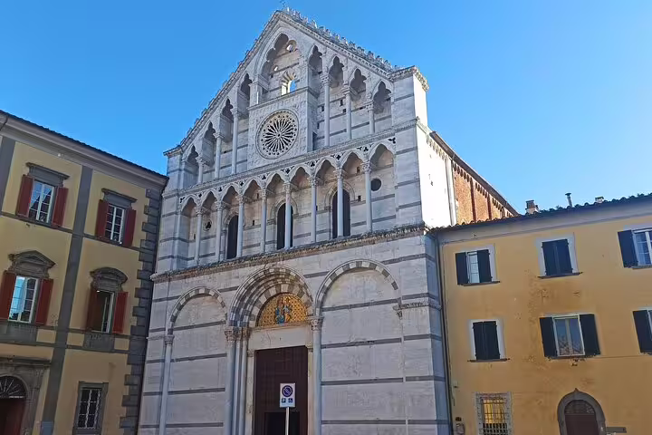 Romanesque marble church facade in Lucca’s historic center, visited on Pisa & Lucca private shore excursion from La Spezia
