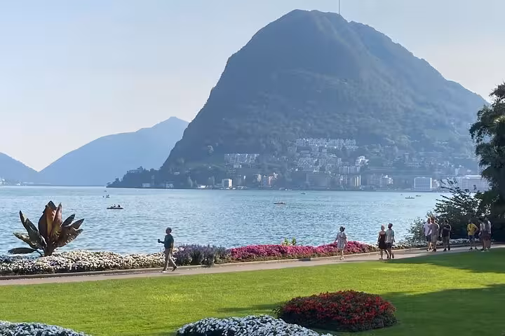 Lugano city tour view of Lake Lugano and Monte San Salvatore from Parco Ciani lakeside gardens