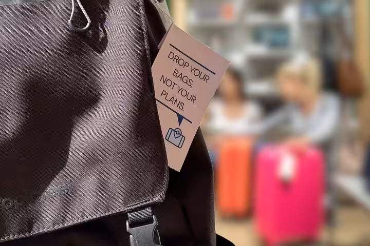 Backpack with “Drop your bags” tag promoting secure luggage storage near Paris Gare du Nord station