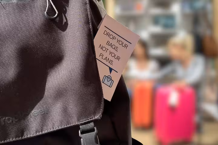 Backpack tag reading “Drop your bags, not your plans” for luggage storage near Musée d’Orsay in Paris