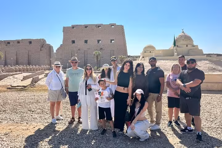 Travelers at Karnak Temple complex on Luxor tour from Marsa Alam, visiting Valley of the Kings highlights