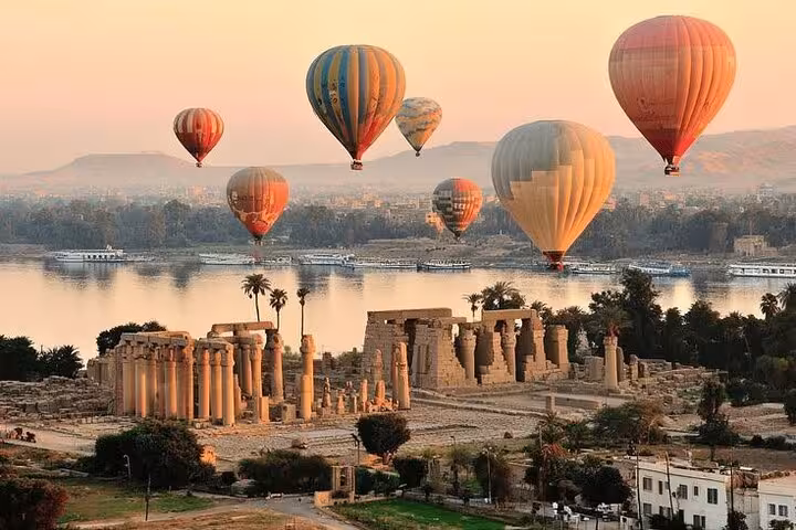 Hot air balloons over Luxor temples and the Nile River at sunrise, classic Nile River Valley balloon tour