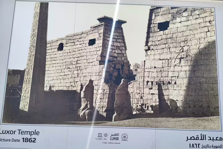 Historic 1862 Luxor Temple photo display showing obelisk and statues, ideal for luxury Egypt Cairo cruise flight package