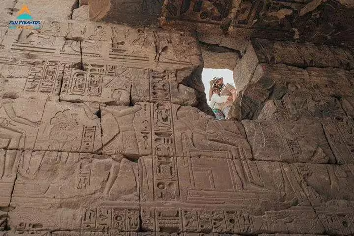Ancient hieroglyph carvings inside Luxor temple, viewed on private Cairo to Luxor by air guided tour