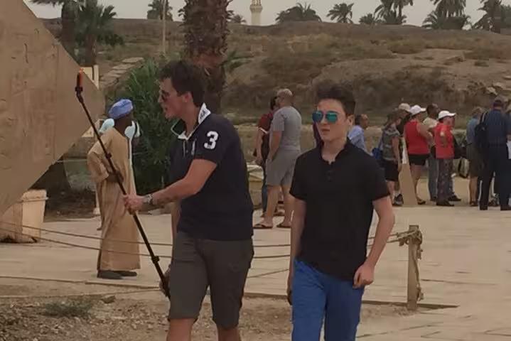 Visitors walking at Luxor Temple during a private Hurghada to Luxor day tour with guided sightseeing