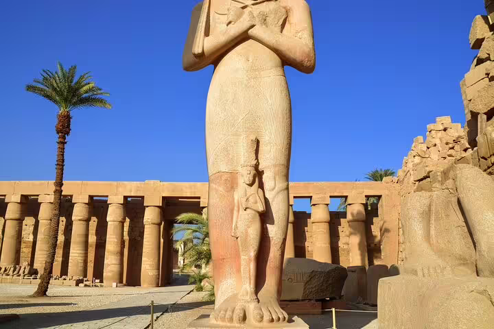 Luxor Temple colossal statue in Karnak complex, a highlight of 4 nights 5 days Nile cruise from Luxor