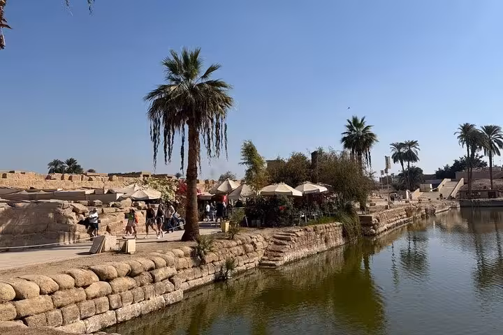 Luxor Temple area by the Nile with palm trees and waterfront promenade, ideal stop on a private Luxor day tour