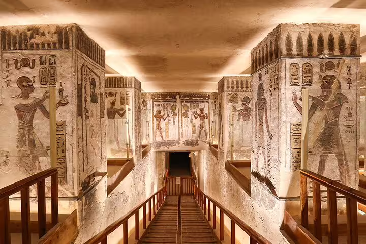 Tomb corridor with vivid ancient Egyptian wall paintings in Luxor, visited on a private Cairo to Luxor flight tour
