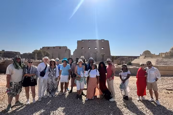Group photo at Karnak Temple complex in Luxor on guided Valley of the Kings excursion from Marsa Alam