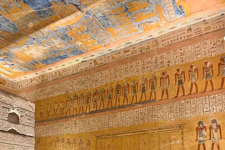 Intricately detailed hieroglyphs and colorful frescoes adorn the walls of a tomb in Luxor's Valley of the Kings.