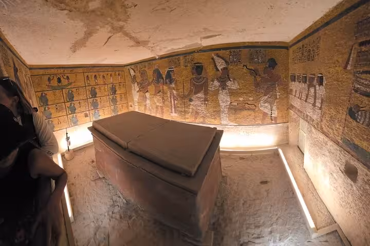 Painted burial chamber with sarcophagus in Valley of the Kings tomb on a private Luxor day tour visit