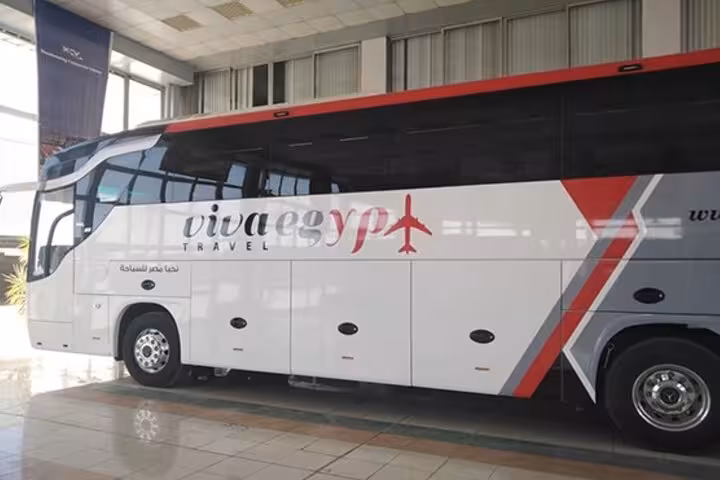 Air-conditioned tour bus for full-day Luxor Valley of the Kings trip, comfortable Egypt day tour transfer