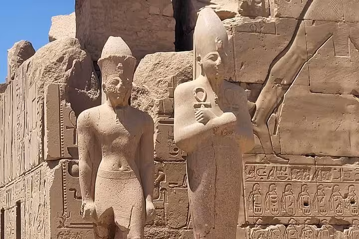 Marvel at the grand statues at Luxor West Bank, capturing the essence of ancient Egyptian pharaohs on a private tour.