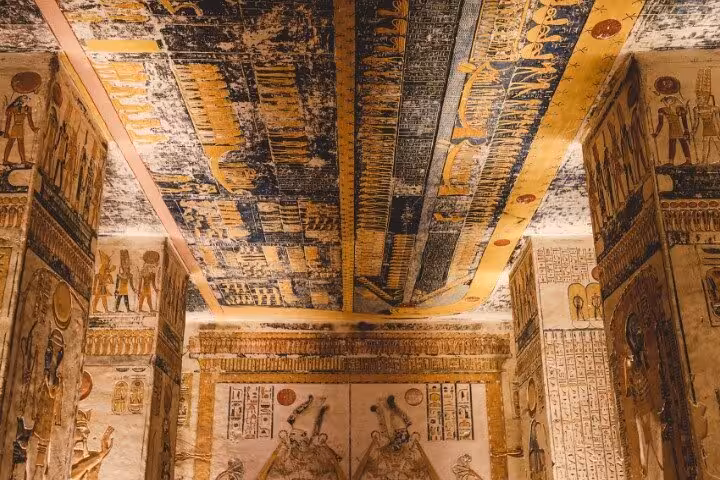 Painted tomb ceiling in Valley of the Kings, Luxor West Bank tour with vivid hieroglyphs and art