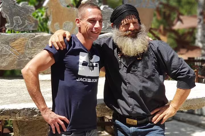 Two men smiling and posing together during a break on a luxury 4x4 excursion tour.