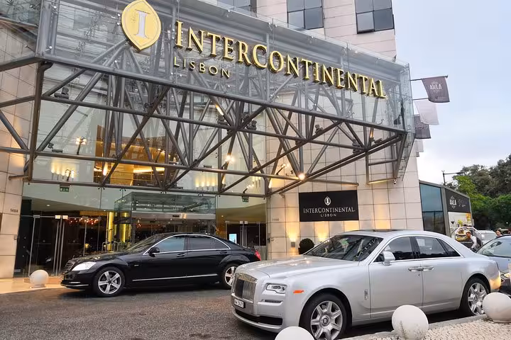 Luxury airport shuttle car at InterContinental Lisbon entrance for Lisbon city transfer and return service