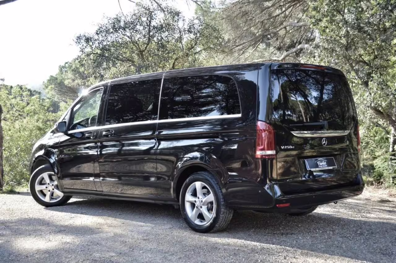 Luxurious black van for private transfers from Lisbon to Porto with optional scenic stops.