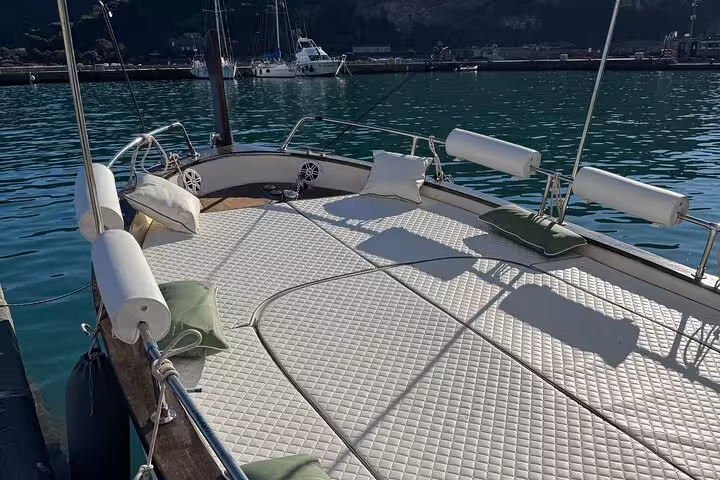 Spacious deck of a luxury boat at Cinque Terre, perfect for sunbathing and enjoying a dream tour of the Italian coast.