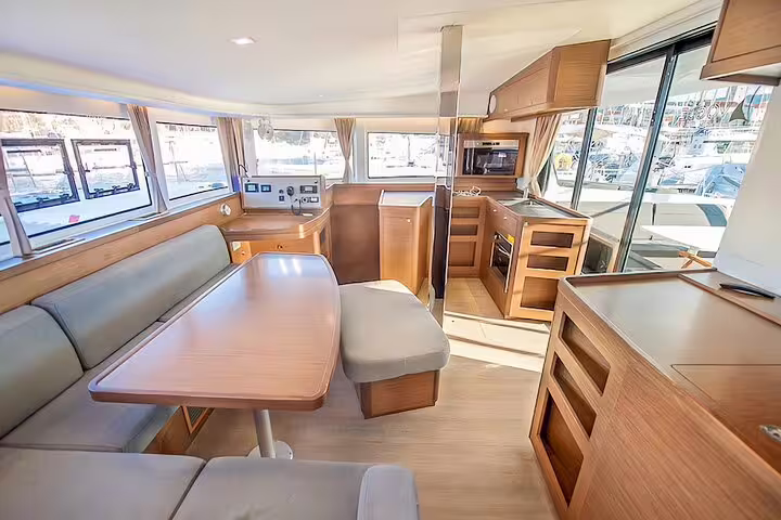 Spacious interior of a luxury catamaran on Madeira Island, featuring modern amenities for a comfortable half-day tour.