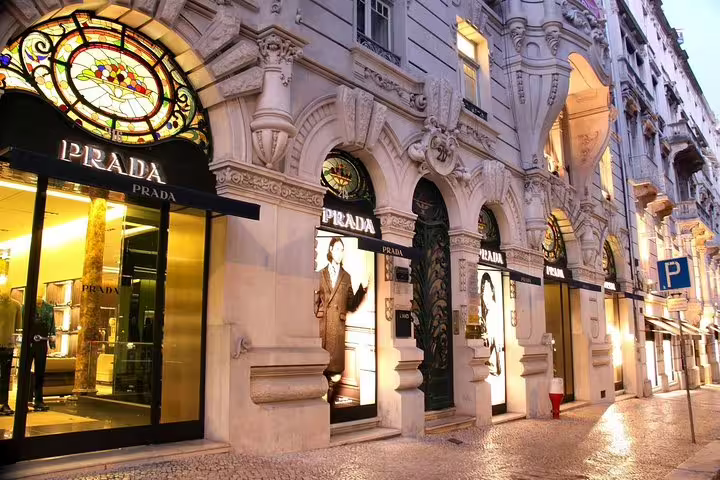 Elegant façade of a luxury store in Lisbon, showcasing architectural beauty on a half-day private outlet shopping tour.