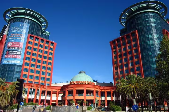 Vibrant view of Colombo Shopping Center, a key stop on the Lisbon Outlet Shopping Half Day Private Tour, under sunny skies.