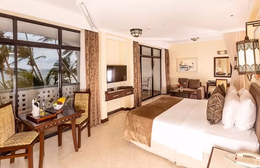 Luxurious hotel room with ocean view and modern amenities in Nairobi, Naivasha, Maasai Mara & Coast tour package.