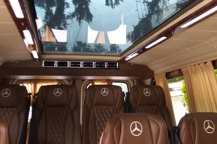 Luxury Mercedes van interior with panoramic roof for private transfer Athens Airport to Piraeus Port hotel