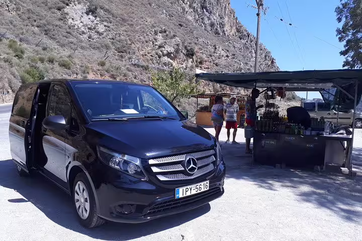 Luxury Mercedes van at a scenic roadside stop during the Elafonisi Beach private tour from Chania, Crete.