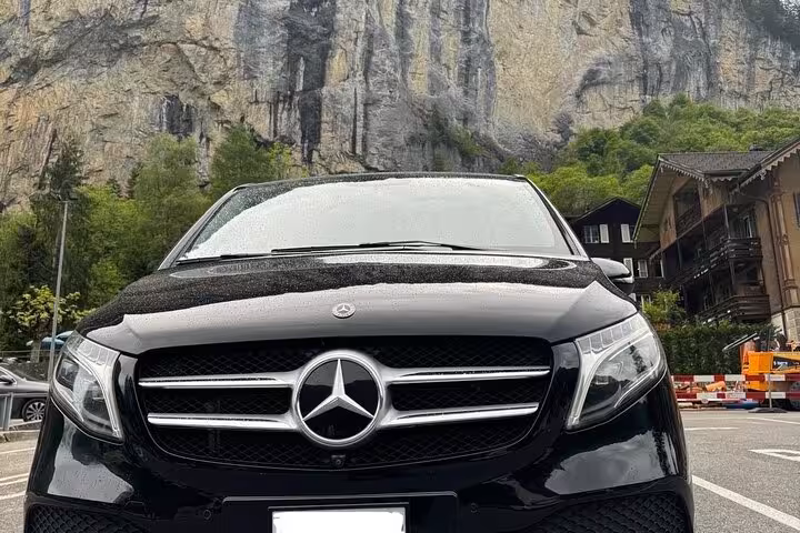 Luxury Mercedes van for Zurich Airport transfer service, private chauffeur pickup in Switzerland