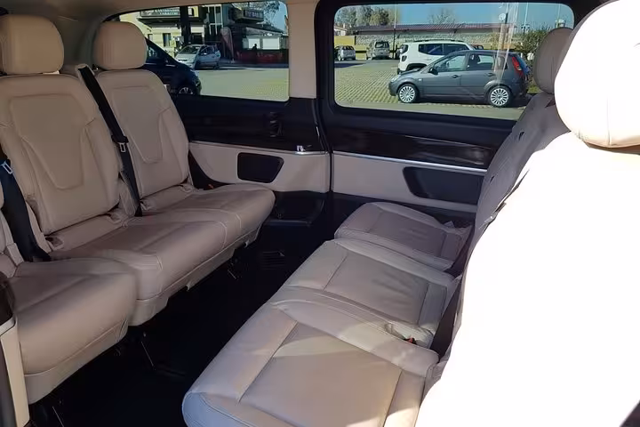 Luxury minivan interior with leather seats for private Rome to Fiumicino Airport transfer service