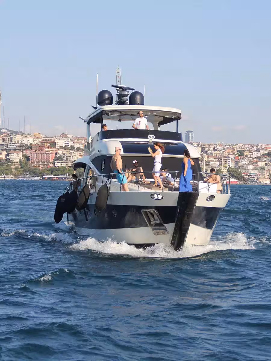 Luxury motor yacht birthday party cruising on the Bosphorus in Istanbul with guests enjoying the sun deck